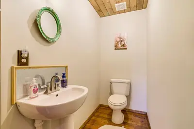 a bathroom with a sink and a toilet at Ski, Swim, Relax Old-Fashioned Poconos Getaway in Pocono Pines