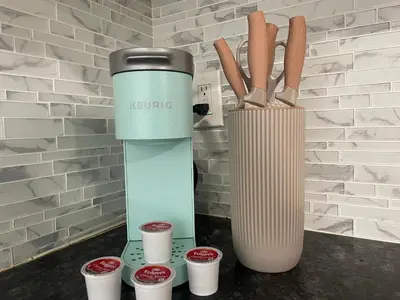 a coffee maker and some cups on a counter at 1711 Edgley Street in Philadelphia