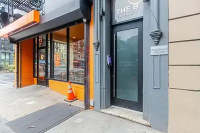 an entrance to a store with an orange cone in front at Blueground Alphabet City view nr Tompkins Sq Park NYC-1884 in New York