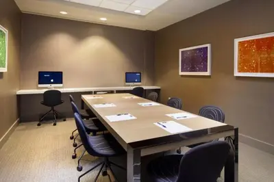 a conference room with a large table and chairs at Blueground Chelsea rooftop nr Highline NYC-369 in New York