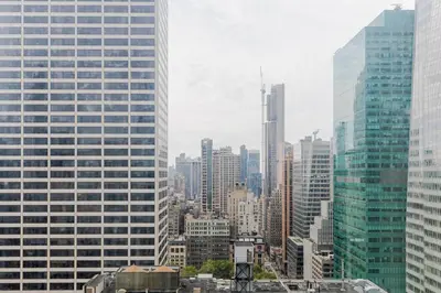 a view of a city skyline with tall buildings at Blueground Midtown South rooftop nr Bryant Park NYC-2028 in New York