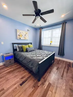a bedroom with a bed and a ceiling fan at New Apt w Washer Dryer Kitchen Rainfall in Chinatown in Philadelphia