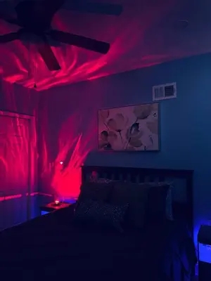 a bedroom with red lights on the walls and a bed at New Apt w Washer Dryer Kitchen Rainfall in Chinatown in Philadelphia