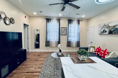 a living room with a couch and a ceiling fan at Brand New Apt w Washer Dryer Kitchen Rainfall in Chinatown in Philadelphia