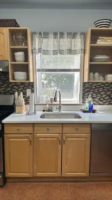 a kitchen with a sink and a window at Modern Comfort 1BR in Jersey City in Jersey City