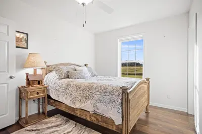 a bedroom with a bed and a window at Tioga's Peaceful Gem