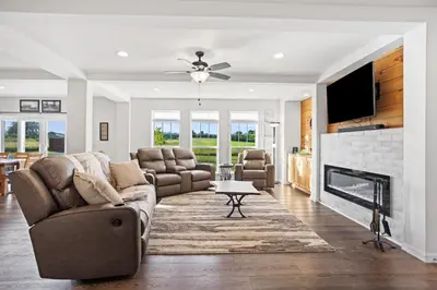 a living room with a couch and a fireplace at Tioga's Peaceful Gem