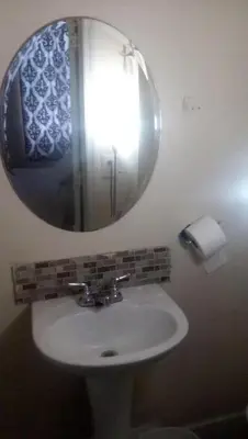 a bathroom with a sink and a mirror at 2131 Double Room with Private Bathroom in Philadelphia