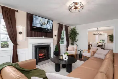 a living room with a couch and a fireplace at Exclusive Lux Home Near Town • Game Rm • Gym • 4BR in Princeton