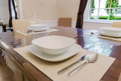 a wooden table with bowls and spoons on it at Exclusive Lux Home Near Town • Game Rm • Gym • 4BR in Princeton