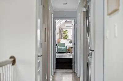 a hallway with a room with a bed in it at Large Group Friendly 2 Game Rooms Indoor Sauna Hot Tub Near Jack Frost Ski Resort in Blakeslee