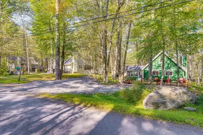 an empty road in front of a house at Fishing, Fun and Fall Foliage! Pocono Lake Cabin in Pocono Lake