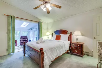 a bedroom with a bed and a ceiling fan at 7 Mi to Big Boulder Mtn! Home with Pet-Friendly Yard in Towamensing Trails