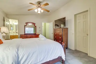 a bedroom with a white bed and a ceiling fan at 7 Mi to Big Boulder Mtn! Home with Pet-Friendly Yard in Towamensing Trails