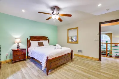 a bedroom with a bed and a ceiling fan at 7 Mi to Big Boulder Mtn! Home with Pet-Friendly Yard in Towamensing Trails