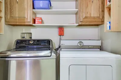 a small kitchen with a stove and a dishwasher at 7 Mi to Big Boulder Mtn! Home with Pet-Friendly Yard in Towamensing Trails