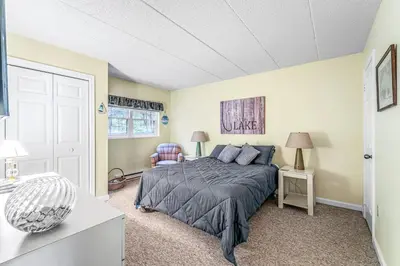 a bedroom with a bed in a room at Epic Views and Pool Access! Gem on Big Boulder Lake in Lake Harmony