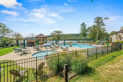 an image of a pool with tables and chairs at Epic Views and Pool Access! Gem on Big Boulder Lake in Lake Harmony