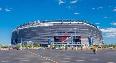 a large building in front of a parking lot at Luxury Queen Studio- Minutes To NYC, EWR & MetLife in Elizabeth