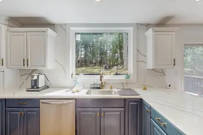 a kitchen with a sink and a window at Blue Mountain Crossing in East Stroudsburg