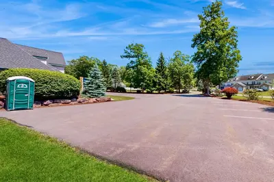 a street in a residential neighborhood with a green mailbox at Blue Mountain Crossing in East Stroudsburg