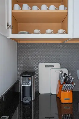 a kitchen with a counter with a coffee maker at Nyc skyline view, 17m- Manhattan, Prime location in Carlstadt