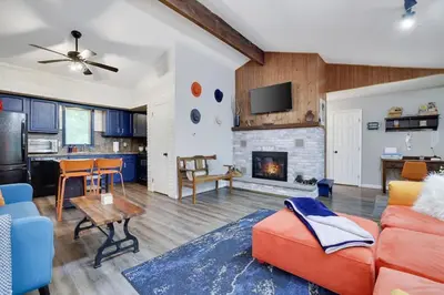a living room with a couch and a fireplace at Gloria's Hot Tub Game Room Fire Pit in Blakeslee