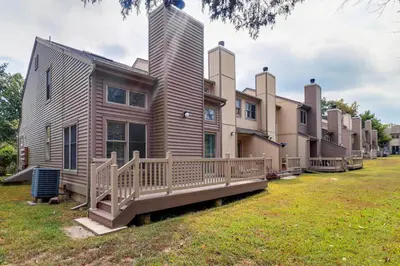 a modular home with a deck and a tall building at Family Gem with Deck Across From Shawnee Mountain! in East Stroudsburg