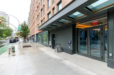 an empty sidewalk in front of a building at Blueground Alphabet City rooftop nr Tompkins Square Park NYC-2057 in New York