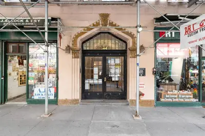 an entrance to a store with a large glass door at Blueground Lincoln Square view nr Central Park NYC-2065 in New York