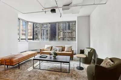 a living room with couches and chairs and a table at Blueground Hells Kitchen fitness center nr Hudson River Park NYC-2086 in New York