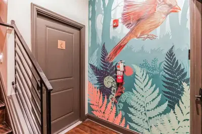 a door with a painting of a bird on the wall at Jr 1Br w 2 Beds - Sleeps 4 - 10 min to DT in Philadelphia