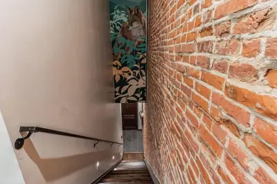 a brick wall with a picture of a dog on the wall at Jr 1Br w 2 Beds - Sleeps 4 - 10 min to DT in Philadelphia