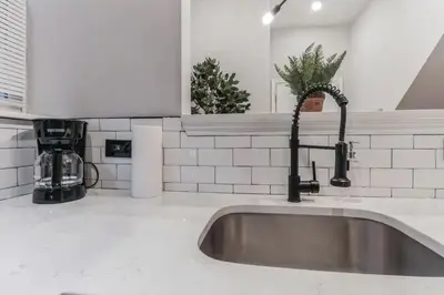 a kitchen sink with a faucet on top of it at Jr 1Br w 2 Beds - Sleeps 4 - 10 min to DT in Philadelphia