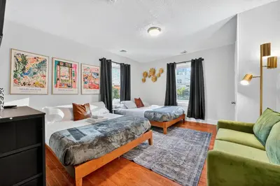 a living room with two beds and a couch at Large Studio in Center City that Sleeps 4 with Fast Wifi in Philadelphia