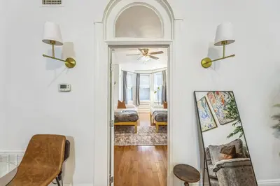 a hallway with a door leading to a living room at Charming 1BR in Center City that Sleeps 4 with Fast WiFi in Philadelphia