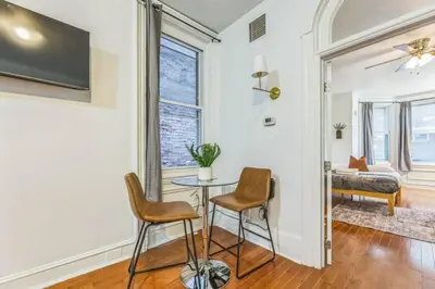 a living room with a table and two chairs at Charming 1BR in Center City that Sleeps 4 with Fast WiFi in Philadelphia