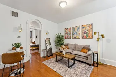 a living room with a couch and a table at Charming 1BR in Center City that Sleeps 4 with Fast WiFi in Philadelphia