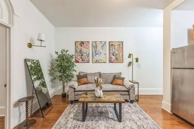 a living room with a couch and a table at Charming 1BR in Center City that Sleeps 4 with Fast WiFi in Philadelphia
