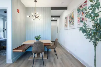 a dining room with a wooden table and chairs at 1 BR Across from Fairmount Park -10 mins to DT (D) in Philadelphia