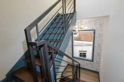 a staircase in a house with a window at 1 BR Across from Fairmount Park -10 mins to DT (D) in Philadelphia