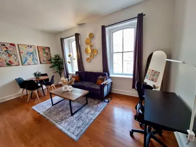 a living room with a couch and a table at Brand New Center City 1BR with King Bed and Fast WiFi in Philadelphia