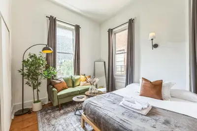 a bedroom with a large bed and a couch at New Studio in Center City that Sleeps 4 with Fast Wifi in Philadelphia