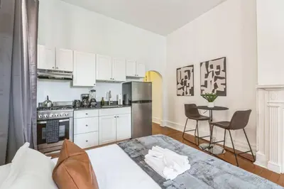 a kitchen with a bed and a table in a room at New Studio in Center City that Sleeps 4 with Fast Wifi in Philadelphia