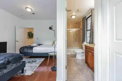 a bedroom with a bed and a toilet and a bathroom at 1BR Across Convention Center in Philadelphia