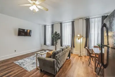 a living room with a couch and a table at Large Historical 1BR Center City that Sleeps 4 in Philadelphia