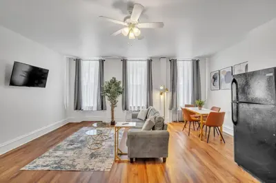 a living room with a couch and a table at Large Historical 1BR Center City that Sleeps 4 in Philadelphia