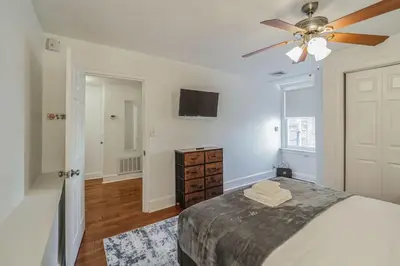 a bedroom with a bed and a ceiling fan at Huge and Sunny 1BR in Center City in Philadelphia