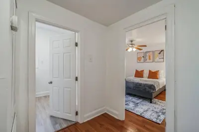 a bedroom with a bed and a white door at Huge and Sunny 1BR in Center City in Philadelphia