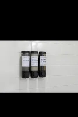 three bottles on a white shelf in a room at Modern 2 bedroom 1 bath unit 2 Near Airport, Xfinity Arena and Eagles Stadium in Philadelphia